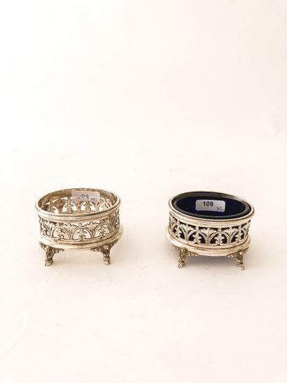 HALPHEN
Pair of oval quadripod salt shakers,...