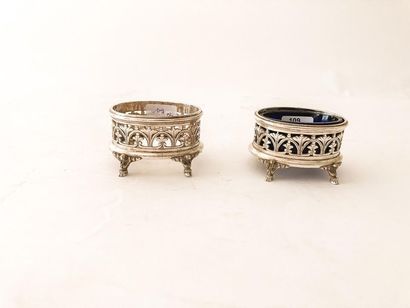 HALPHEN
Pair of oval quadripod salt shakers,...