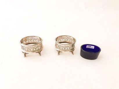 HALPHEN
Pair of oval quadripod salt shakers,...