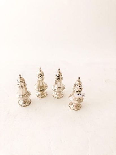 Suite of four elegant salt shakers in baluster...