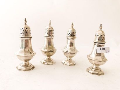 Suite of four elegant salt shakers in baluster...