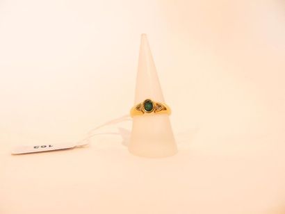 18 karat yellow gold ring set with an emerald...