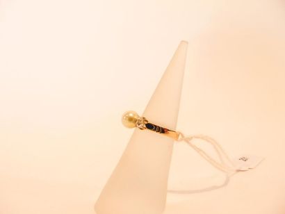 18 karat yellow gold ring set with a cultured...