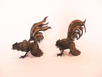 Pair of cocks in embossed and chased silver,...