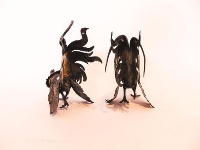 Pair of cocks in embossed and chased silver,...