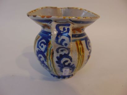 A small pitcher with polychrome decoration...