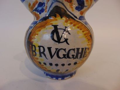 A small pitcher with polychrome decoration...