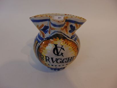 A small pitcher with polychrome decoration...