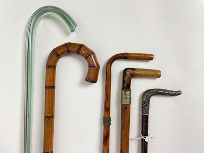 Lot of five antique canes, one of which is...