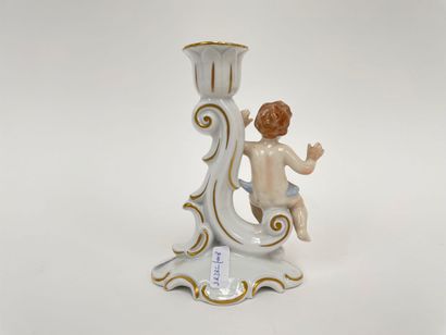 Rocaille torch decorated with a putto in...