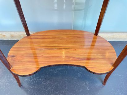 Transitional style kidney-shaped coffee table...