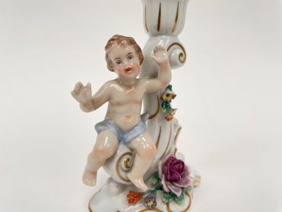 Rocaille torch decorated with a putto in...