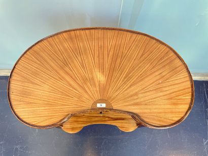 Transitional style kidney-shaped coffee table...