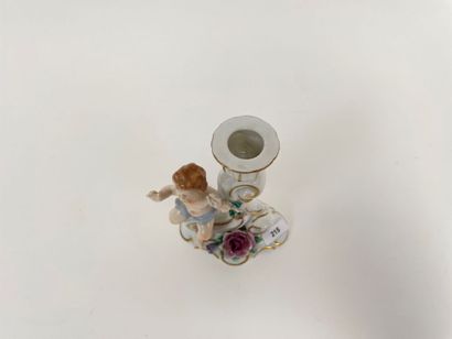 Rocaille torch decorated with a putto in...