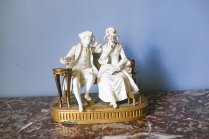 LAGNEAU, groupe en bronze doré et biscuit...