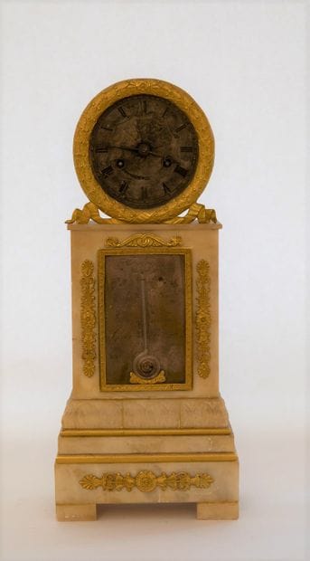 Pendule de cheminée à sonnerie au passage...
