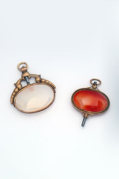 Two large gilded brass watch keys decorated...