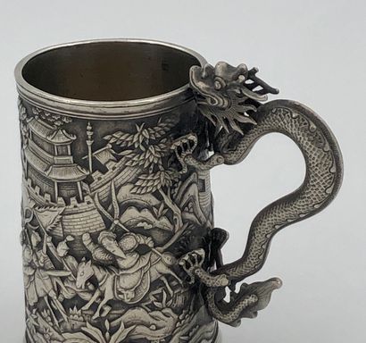 Small silver mug, decorated with battle scenes...