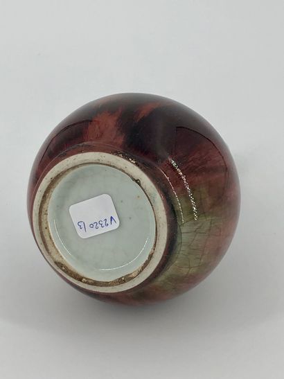 A long-necked porcelain vase enamelled with...
