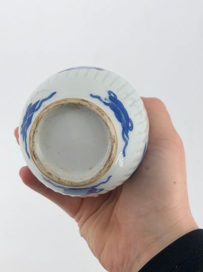 Small ovoid vase in blue-white porcelain...