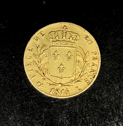FRANCE
Une pièce de 20F or Louis XVIII Buste...
