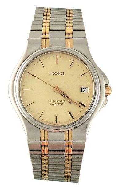 TISSOT
Acier et or avec dateur; mouvement...