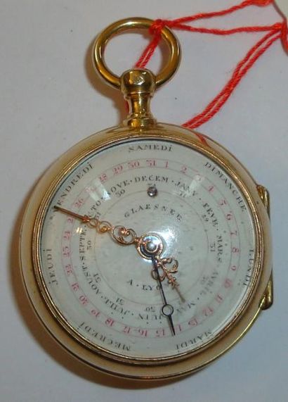 Montre double face à calendrier en vermeil...