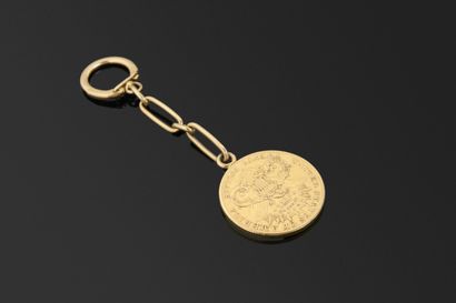 Porte-cléfs en or jaune 18K 750°/°° retenant...