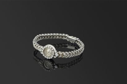 OMEGA. Montre de soirée en or gris 18K, 750/°°°....