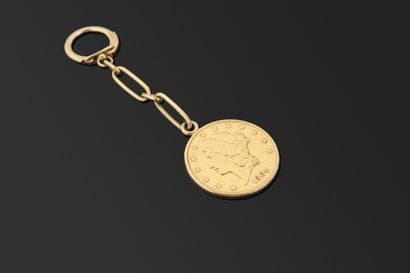 Porte-cléfs en or jaune 18K 750°/°° retenant...