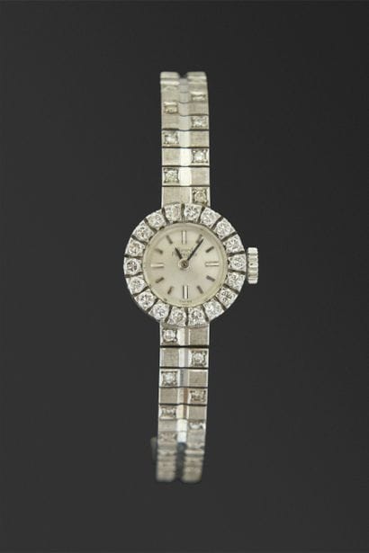 Montre de dame en or gris 18K, 750/°°° lunette...