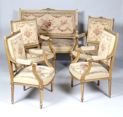 Suite de quatre fauteuils et un canapé en...