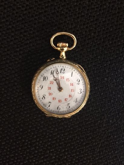 Montre de col en or à décor de feuillages...
