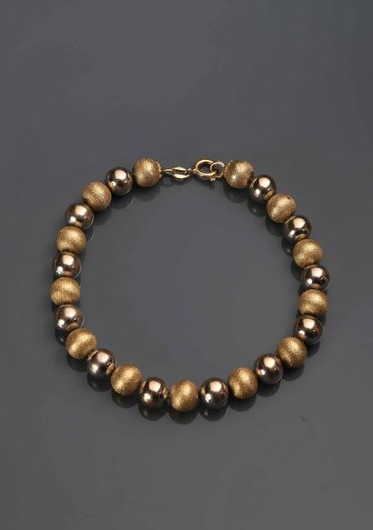 Bracelet en or jaune 18K (750°/00) à boules...
