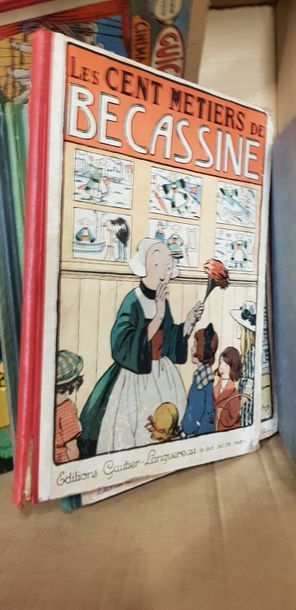 Un carton de bandes dessinées anciennes dont...