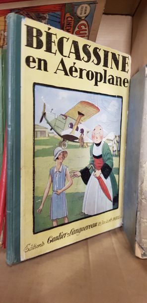 Un carton de bandes dessinées anciennes dont...