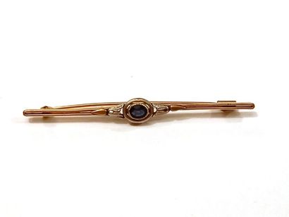 Broche en métal doré et pierre d'imitati...