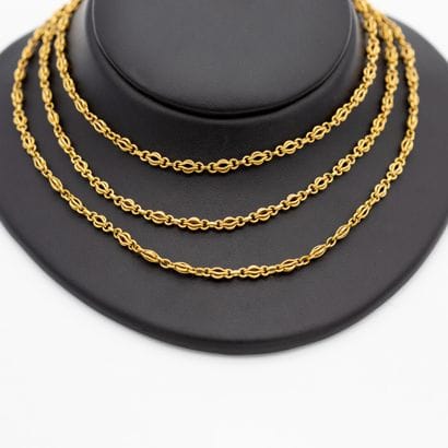 Important sautoir en or jaune 18K (750) maillons...