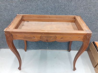 Console en bois naturel à décor de feuillages...