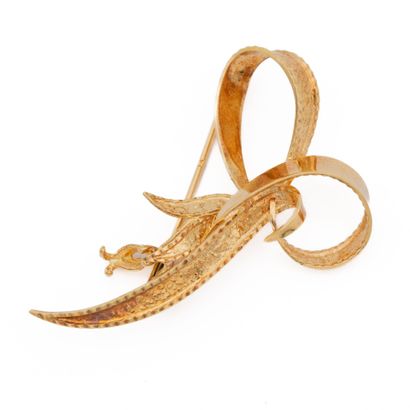 Broche en or jaune (750) 18K figurant un...