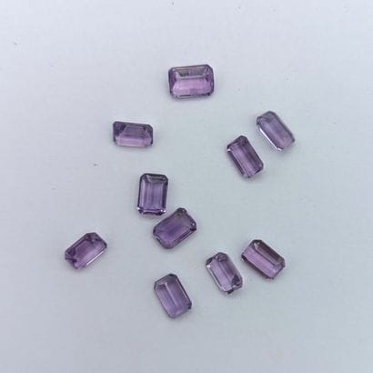 Lot of ten degree-cut amethysts with a total...