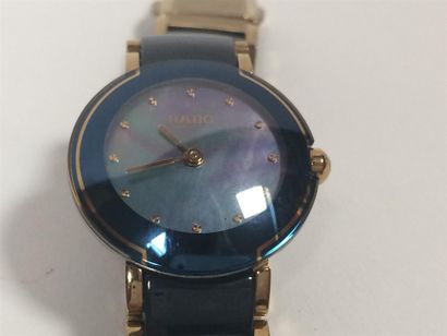 RADO Montre dame en métal doré et céramique...