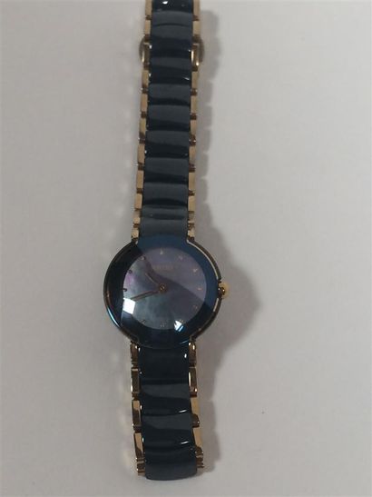 RADO Montre dame en métal doré et céramique...