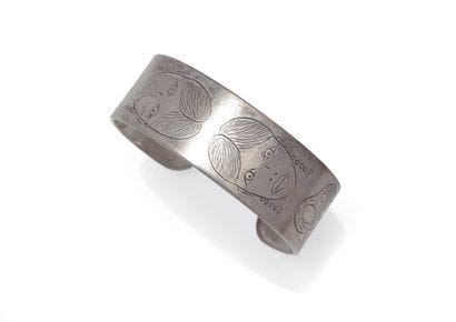 Open silver bracelet decorated with female...
