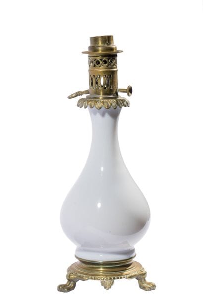 A kerosene lamp consisting of a white opaline...