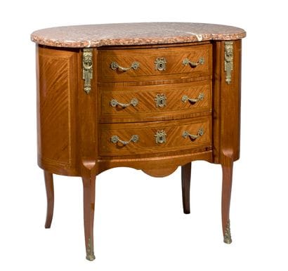 Small, kidney-shaped chest of drawers made...