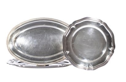 A round silver plated metal platter edged...
