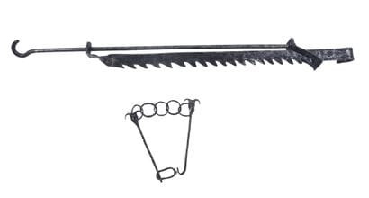 Wedge-shaped fireplace mantel and wrought-iron...