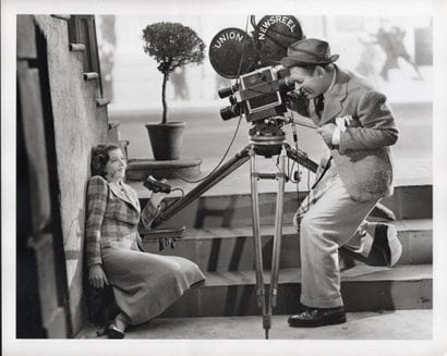 MYRNA LOY AND CLARK GABLE
In front of and...