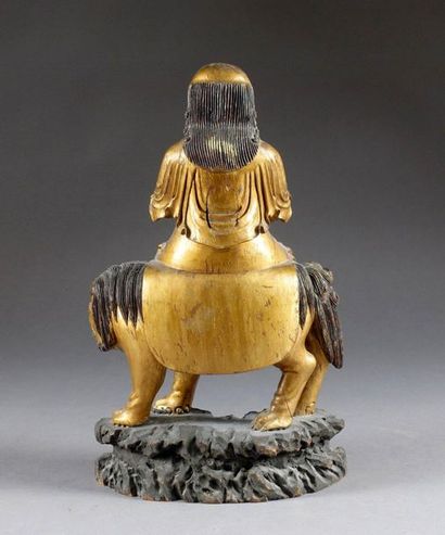Divinité Taoïste.
Holding a scroll, sitting...